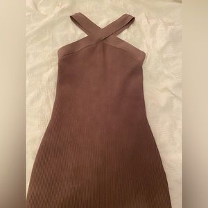 I am selling a Sculpt Knit Criss Cross Dress. Size medium and colour deep taupe.